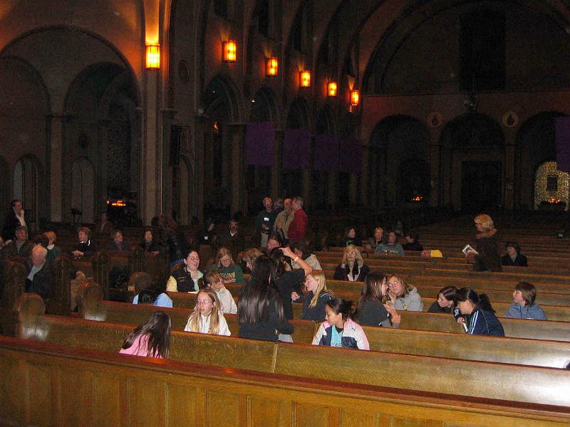F0161_0035.jpg - Chorus waiting 
While waiting for the rehearsal to begin, the Cantabella Children's Chorus sat together in the foreground, while members from the other choruses sat on the left and in the back.